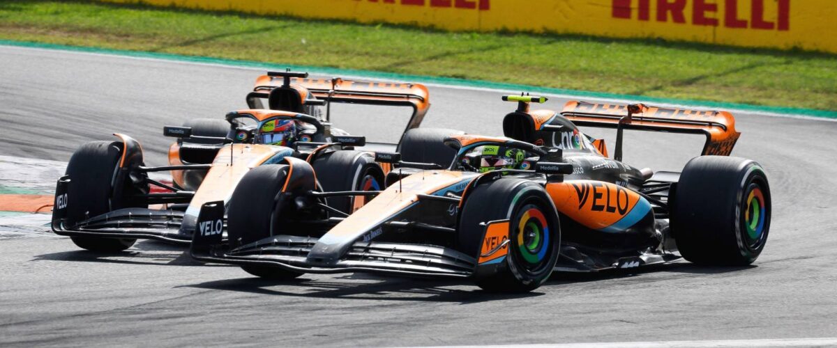 McLaren drivers Oscar Piastri and Lando Norris battle side by side on track during the 2025 Formula 1 championship season.